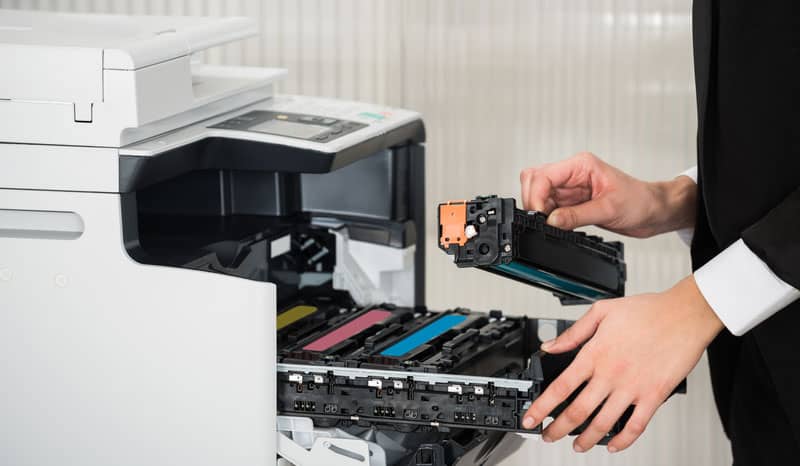 Man repairing Brother printer in a Sydney office