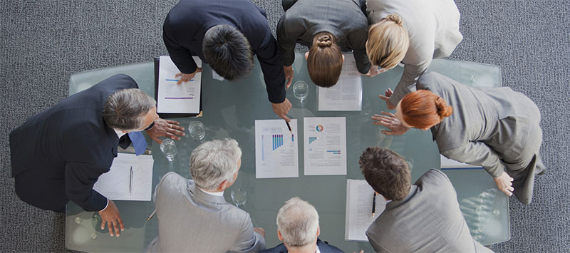Office staff meeting to discuss HP printer repair problems in Sydney